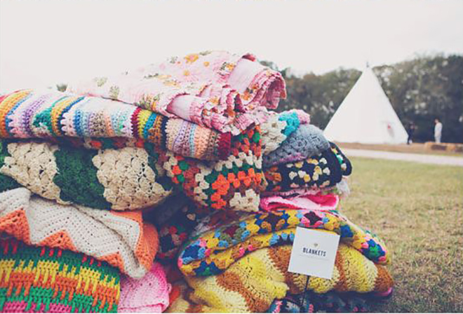 Keep your guests cozy at your fall wedding with vintage blankets.