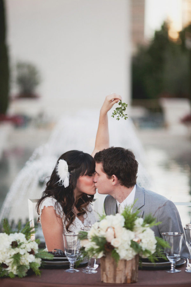 Must have winter wedding photo, under the mistletoe.