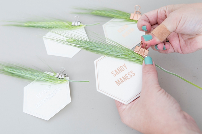 Gorgeous DIY seating and escort cards with leaves and grass!