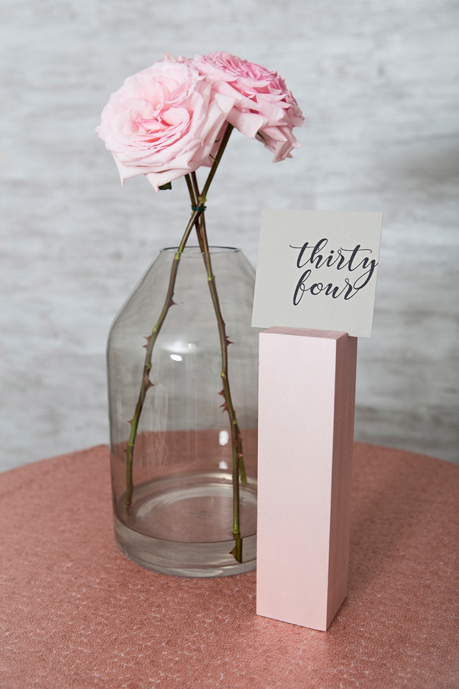 Create your own wood block table number stands and paint them any color!