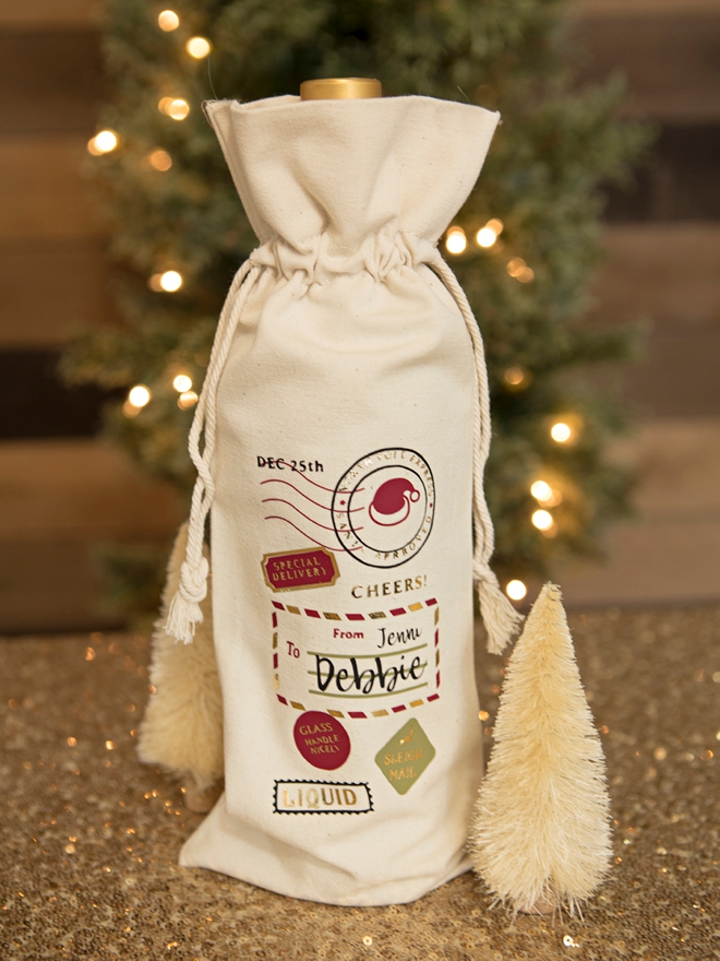 Use your Cricut to make these AMAZING personalized Santa wine bags!