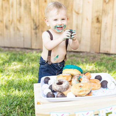OMG! This donut grow up first birthday photo shoot is the absolute cutest!
