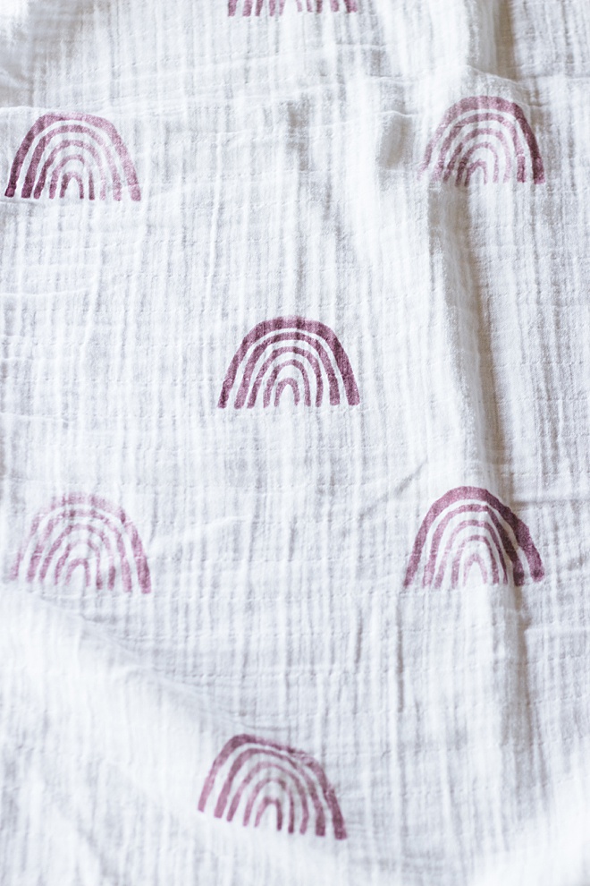 Can't get enough of these modern rainbows you see all over the internet? We are showing you how to make your own stamped muslin blanket on the blog!