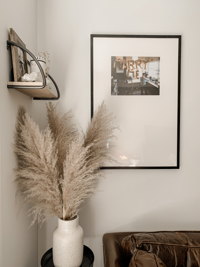 Pampas grass and an oversized mat picture frame gallery wall. Pure neutral living room perfection. #diy #homedecor #pampasgrass