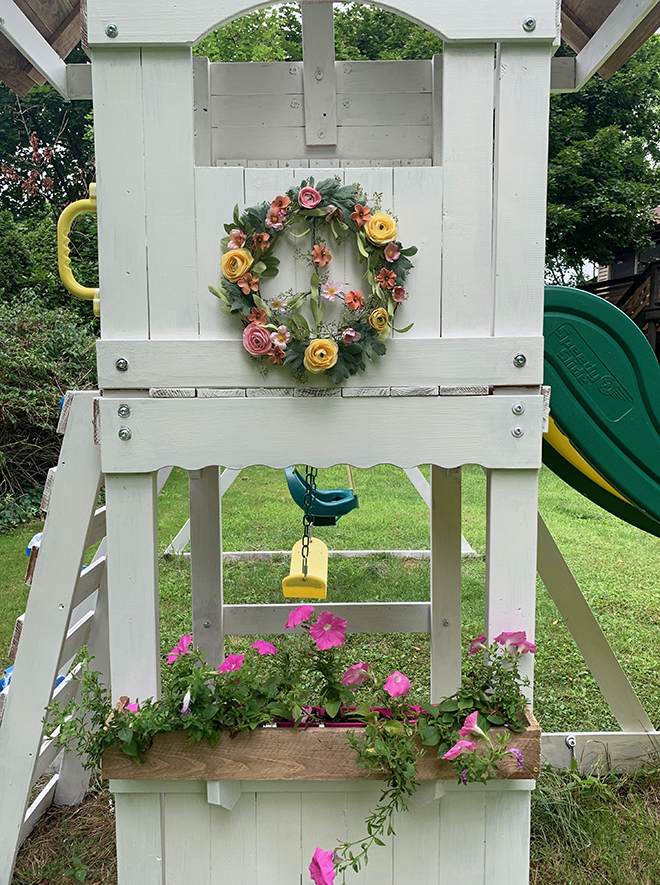 This charming DIY peace wreath makes this play set makeover extra special!