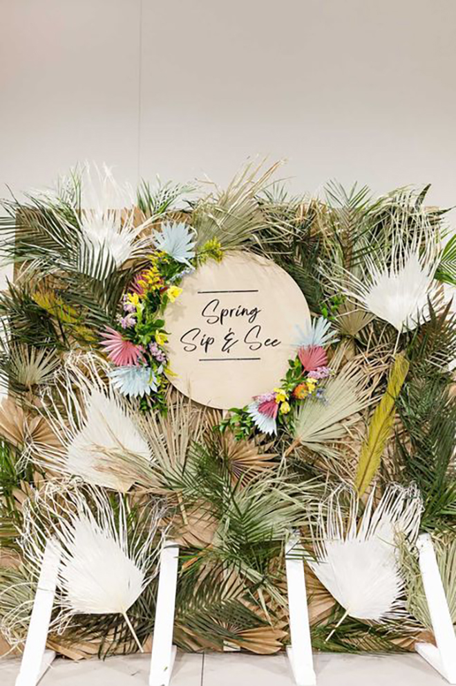 This dried green backdrop was made with paper palm fronds!