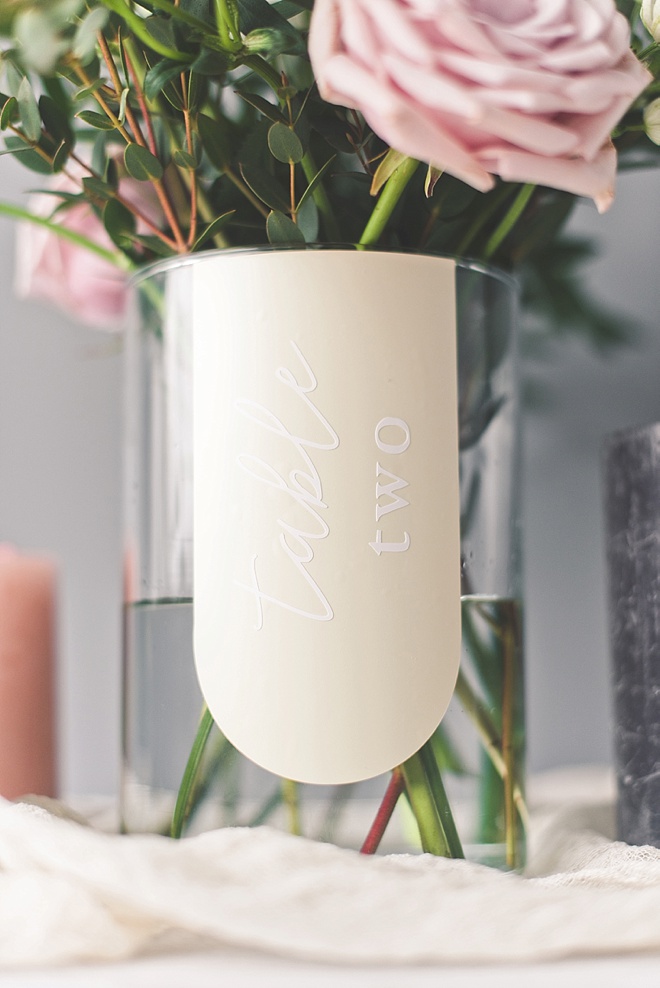 Vinyl and glass vase table numbers made with Cricut machine
