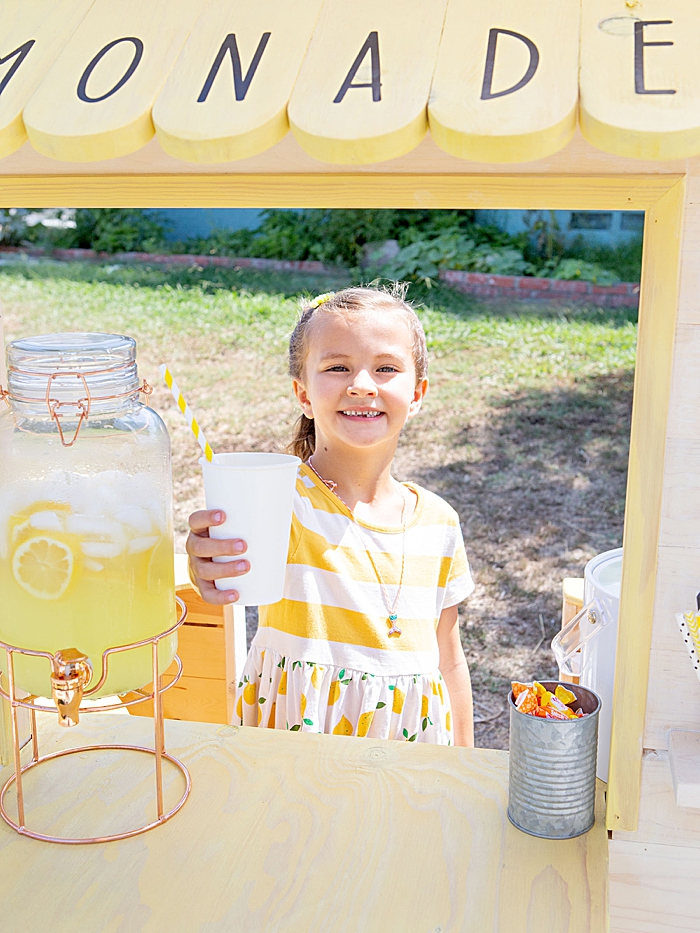 Start teaching your kids about money by hosting a lemonade stand!